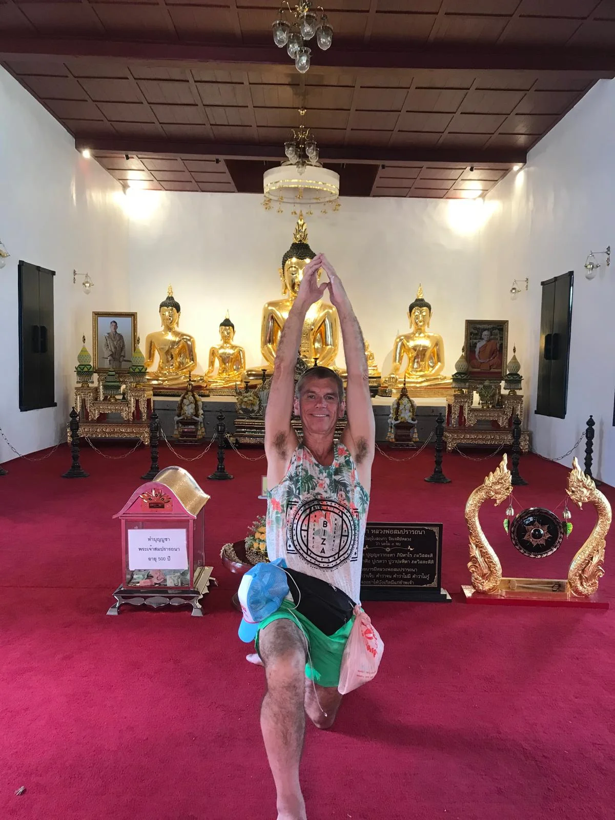 Mark Bell in a balancing prayer pose inside a temple